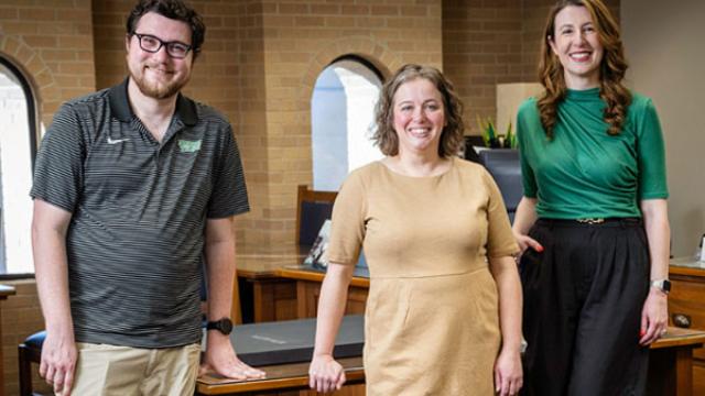 Group of faculty posing together.