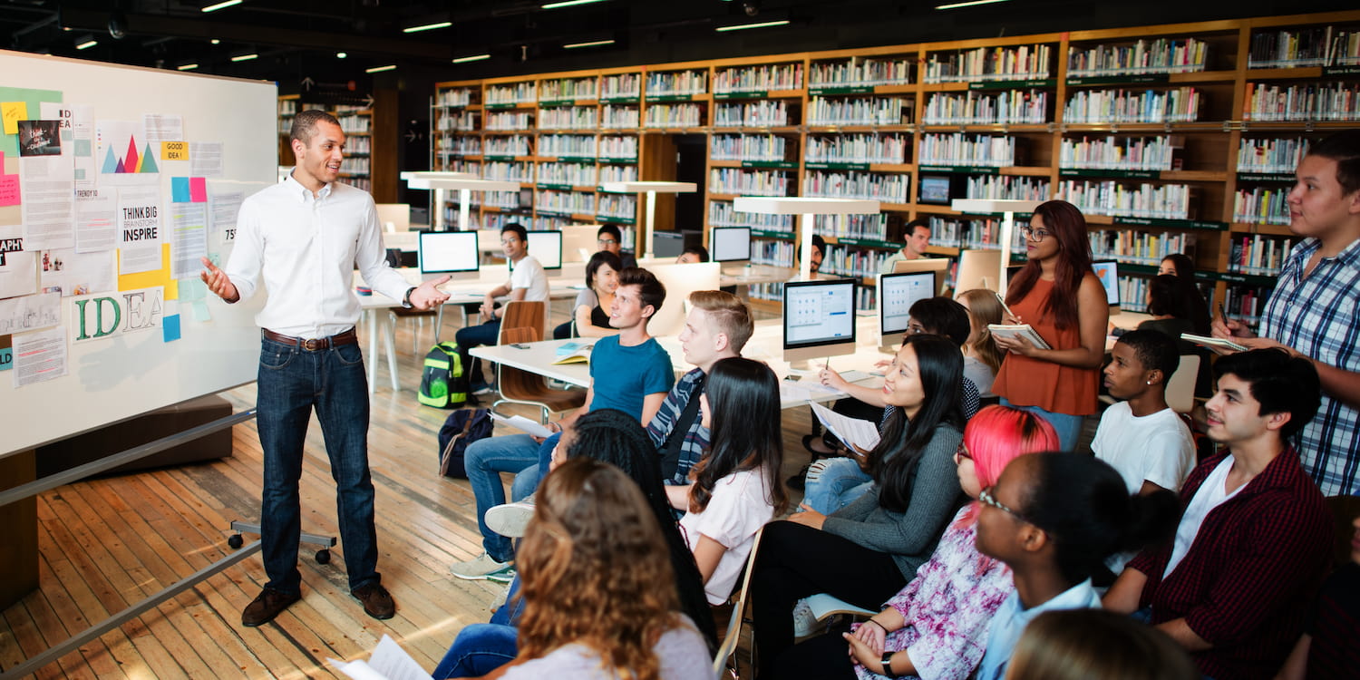 Librarian presenting to students in library
